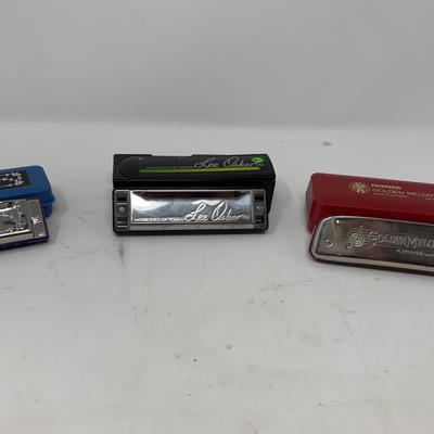 Three Johnson, Lee Oskar and Hohner harmonicas