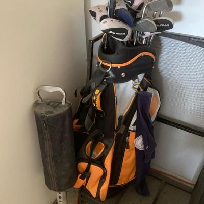 Golf Bag With Clubs And Golf Hole Cutter And Golfballs