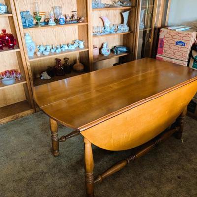 Solid wood table with two folding leaves