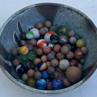 Signed Studio Pottery Bowl With Assorted Glass Pottery, Stone, And Metal Marbles