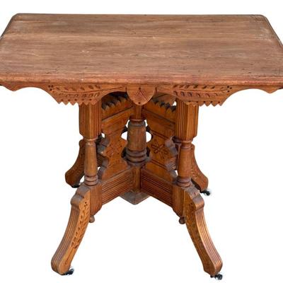 Antique East Lake Parlor Table With Ceramic Casters