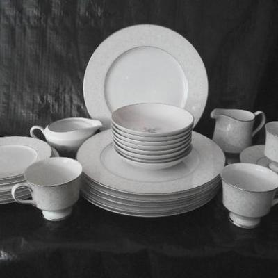 Sale Photo Thumbnail #15: Dinnerware China set-floral rim design. 6 plates; 4 desert plates; 2 saucers, 5 coffee plates, 5 coffee cups, 1 creamer bowl, 1 large oval serving platter.