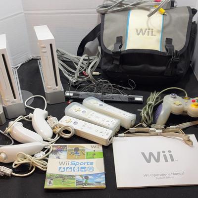 Wii Game Consoles (2) with Case and Several Controllers
