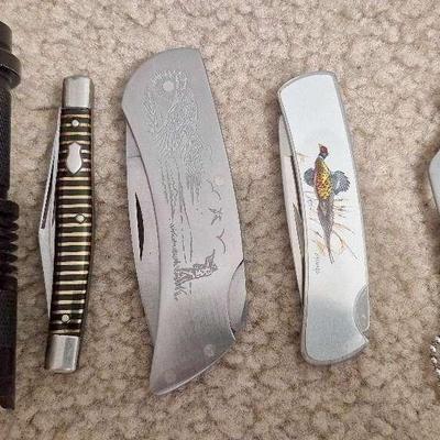 Assortment of Knives And Green Light