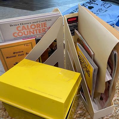 Recipe Box With Various Books And Magazines On Cooking