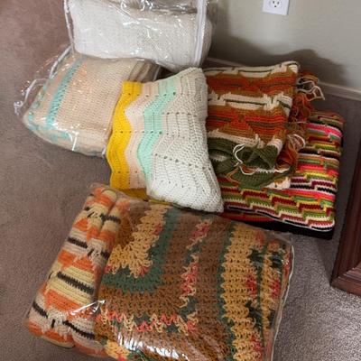 7 Beautiful Crochet blankets. Different sizes and color patterns.