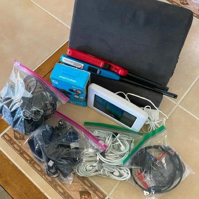 Assortment Of Chargers, Cables And Cords For Phones Plus Grill Lighters And Pillow Pad, Etc