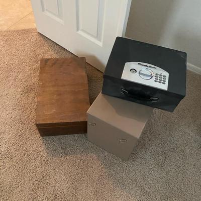 Variety Of Storage And Lock Boxes And Office Supplies
