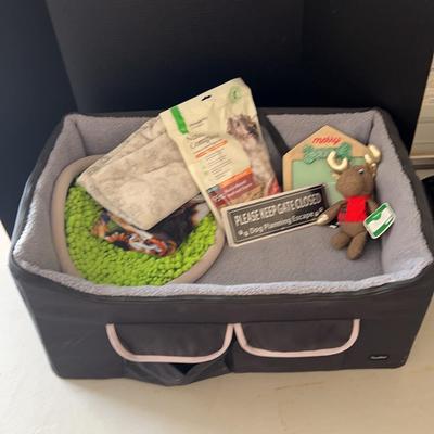 Large Travel Size Pet Bed With Some Food And Extra Supplies