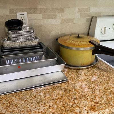 Assorted Bakeware And Pans With Lids And A Pressure Cooker