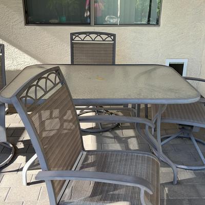 Outdoor Patio Table And 4 Swivel Chairs.