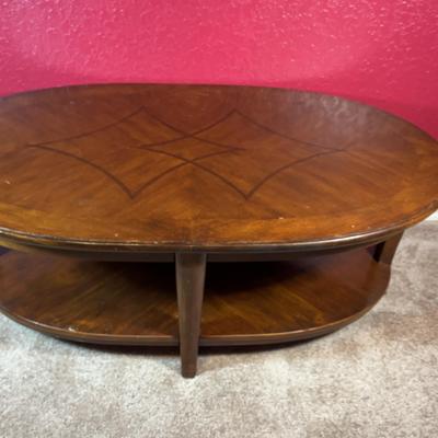 In the Style of Mid-Century Oval Wood Coffee Table with Inlay Design & Shel