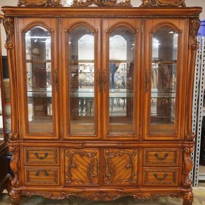 Sale Photo Thumbnail #256: 1254	ORNATE FRENCH STYLE 2 PART BEVELED GLASS BREAKFRONT HAVING 6 DOORS, 4 DRAWERS, MIRROR BACK WITH INTERIOR LIGHTS, GLASS SHELVES AND CARVED PAW FEET BASE, APPROXIMATELY 72 IN X 18 IN X 88 IN H
