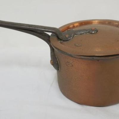 Sale Photo Thumbnail #84: 1083	D. H. & M. CO. NY PRIMITIVE COPPER POT WITH LID AND CAST IRON HANDLES, APPROXIMATELY 7 IN X 13 IN X 6 IN H
