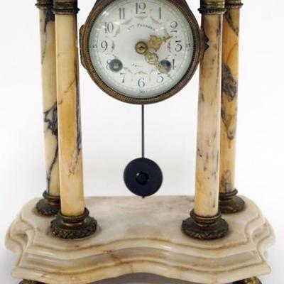Sale Photo Thumbnail #135: 1134	FRENCH MARBLE CLOCK WITH 4 COLUMNS AND PORCELAIN DIAL, BRONZE FERUIS, APPROXIMATELY 10 IN X 5 IN X 12 IN
