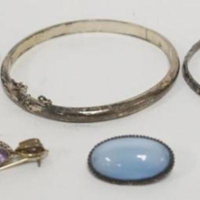 Sale Photo Thumbnail #216: 1214	LADIES STERLING SILVER JEWELRY ASSORTMENT INCLUDING 3 BANGLE BRACELET, 1 BLUE STONE PIN AND AMETHYST EARRINGS, 1.05 OZT INCLUDING STONES
