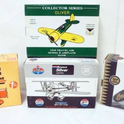Sale Photo Thumbnail #104: 1103	4 DIE CAST AIRPLANE COIN BANKS IN ORGINAL BOXES
