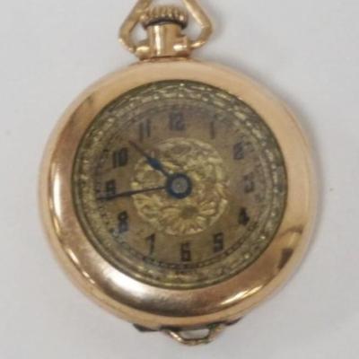 Sale Photo Thumbnail #221: 1219	ANTIQUE LADIES 14K GF 20 YEAR WATCH PENDANT
