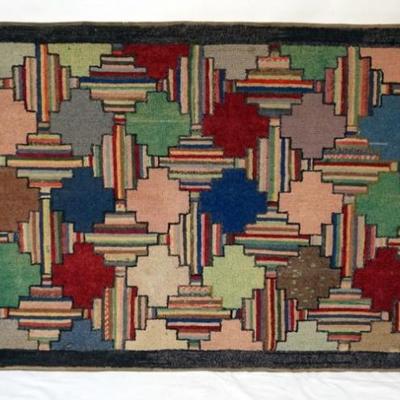 Sale Photo Thumbnail #87: 1086	PRIMITIVE WOVEN THROW RUG MOUNTED ON WOOD STRETCHER FOR HANGING, APPROXIMATELY 32 IN X 53 IN
