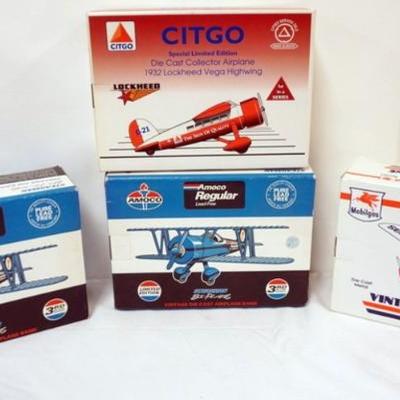 Sale Photo Thumbnail #106: 1105	4 DIE CAST AIRPLANE COIN BANKS IN ORGINAL BOXES
