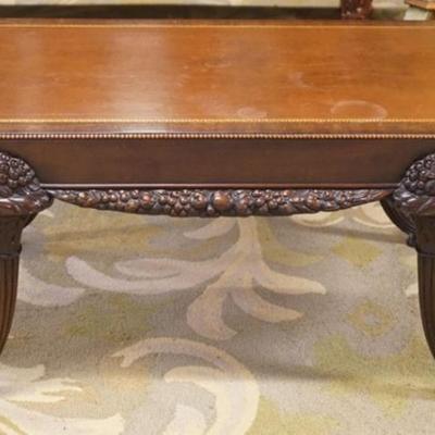 Sale Photo Thumbnail #273: 1271	UNUSUAL LEATHER TOP MAHOGANY COFFEE TABLE WITH CARVED CORNUCOPIA LEGS, APPROXIMATELY 42 IN X 23 IN X 18 IN H
