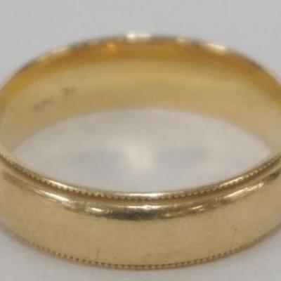 Sale Photo Thumbnail #217: 1215	14K GOLD BAND APPROXIMATE SIZE 8 1/2 MARKED WITH HE COMBINATION AND 14K, 14.34 DWT
