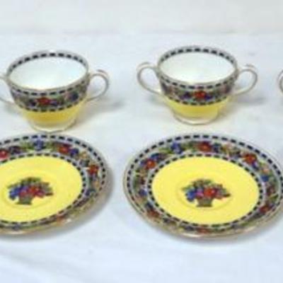1009	WEDGWOOD DOUBLE HANDLED CUPS AND SAUCERS (6) WITH HAND PAINTED FLOWERS IN A BASKET

