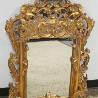 Sale Photo Thumbnail #179: 1178	GILT COMPOSITE FRAMED MIRROR, APPROXIMATELY 25 IN X 42 IN
