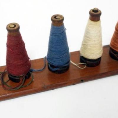 Sale Photo Thumbnail #88: 1087	PRIMITIVE HANGING WOOD YARN HOLDER, APPROXIMATELY 2 1/2 IN  X 14 IN 
