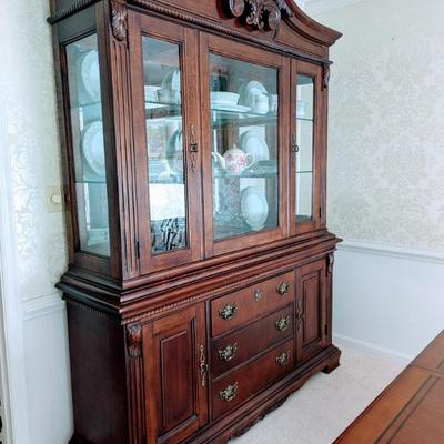 Sale Photo Thumbnail #35: Available for PRESALE-China cabinet with table and 6 chairs for $499.
Bassett China cabinet with light bridge. 66" w, 19" d, 7'2" tall