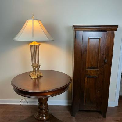 Round Pedestal Table, Table Lamp, and Tall Cabinet