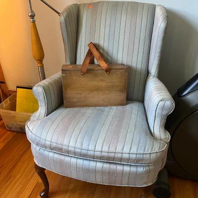 Wooden box with leather handles, wingback chair 