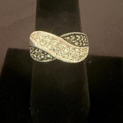 Lot 442: 925 Sterling Silver Infinity-Style Ring with Crystal Accents – 5.5 Grams
