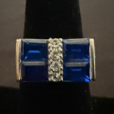 Lot 428: 10K Gold Ring with Blue Gemstones and Diamond Simulants – 4.3 Grams