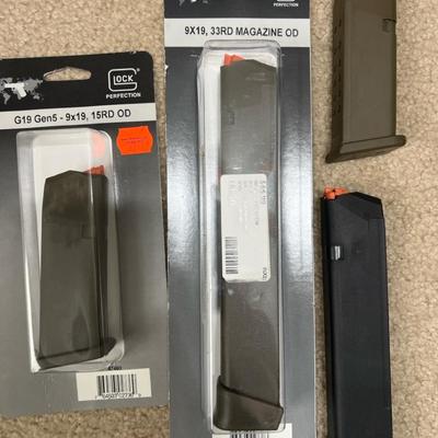 Lot 345: Glock 9mm Magazines – 4 Total (OD + Black, Mixed Capacity)  Mixed set of Glock factory maga