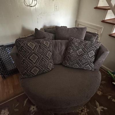 Lot228: Charcoal Grey Swivel “Cuddle Chair”