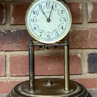 Sale Photo Thumbnail #160: Gold mantle clock on stand