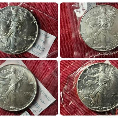 Four Littleton Coin Co Uncirculated American Silver Eagles 