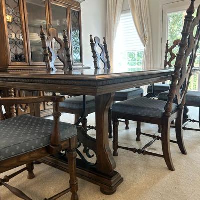 Large dining table and six chairs. Coordinates with china cabinet.