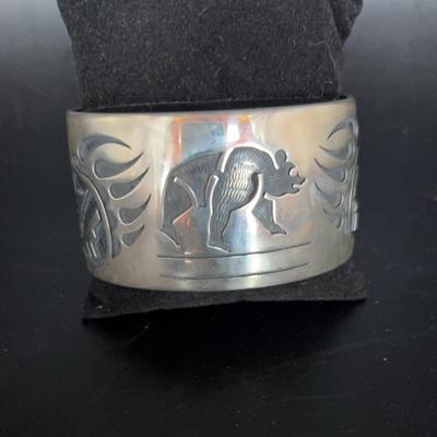 Sterling silver Hopi cuff bracelet engraved with bear and bear paws  Native American
