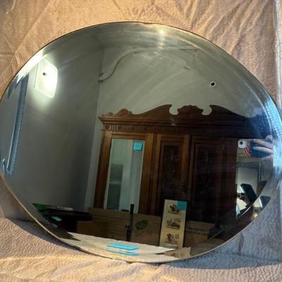 Beveled oval mirror