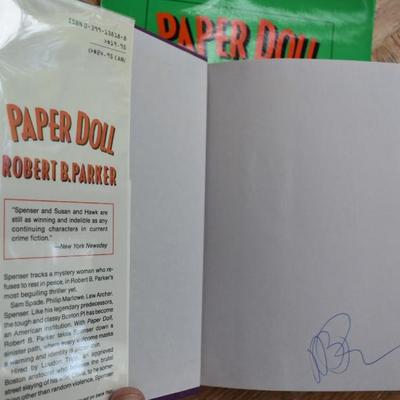 Sale Photo Thumbnail #84: Robert B. Parker Paper Doll Original Press Release SET: Press Release folder, Signed First Edition, & Signed Limited Release First Edition. 