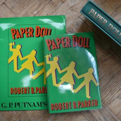 Sale Photo Thumbnail #82: Robert B. Parker Paper Doll Original Press Release SET: Press Release folder, Signed First Edition, & Signed Limited Release First Edition. 