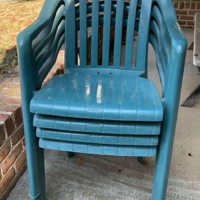 Four Green Plastic Chairs