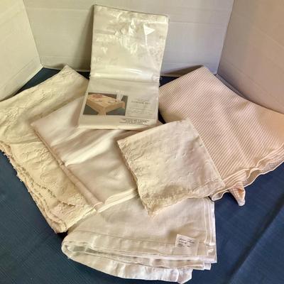 Six Assorted Off-White & Cream Tablecloths