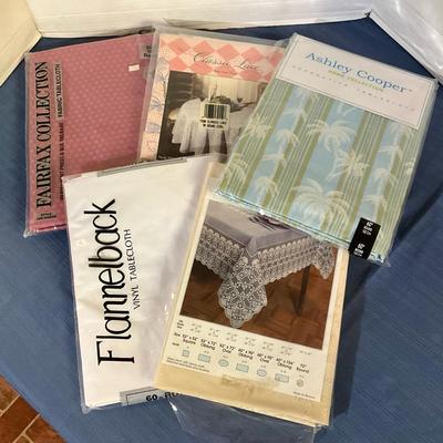 Five Assorted Vinyl & Cotton Tablecloths in Packaging