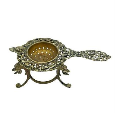 Sale Photo Thumbnail #80: Lot 135   
Brass Ornate Tea Strainer with Stand