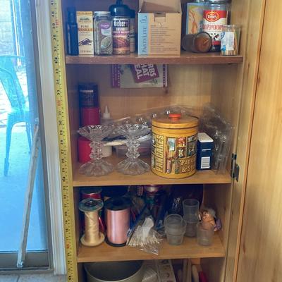 Small Pantry Cabinet with Miscellaneous Items From Ribbons To Seasonings