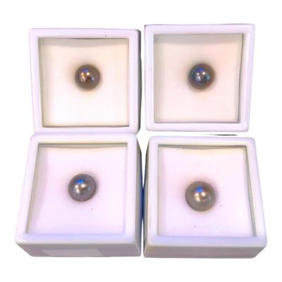 Two 8mm Natural Black Tahitian Pearls And Two 9mm Cultured Black Tahitian Pearls