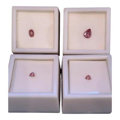 Malaya Garnets: 1.00 CT Pear Shape, 0.40 CT Oval Cut, And Two 0.20 Trillion Cut